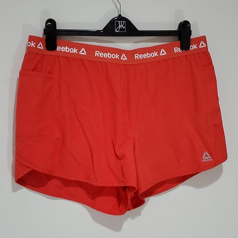 REEBOK large orange athletic shorts